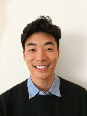 A young man smiling for the camera.