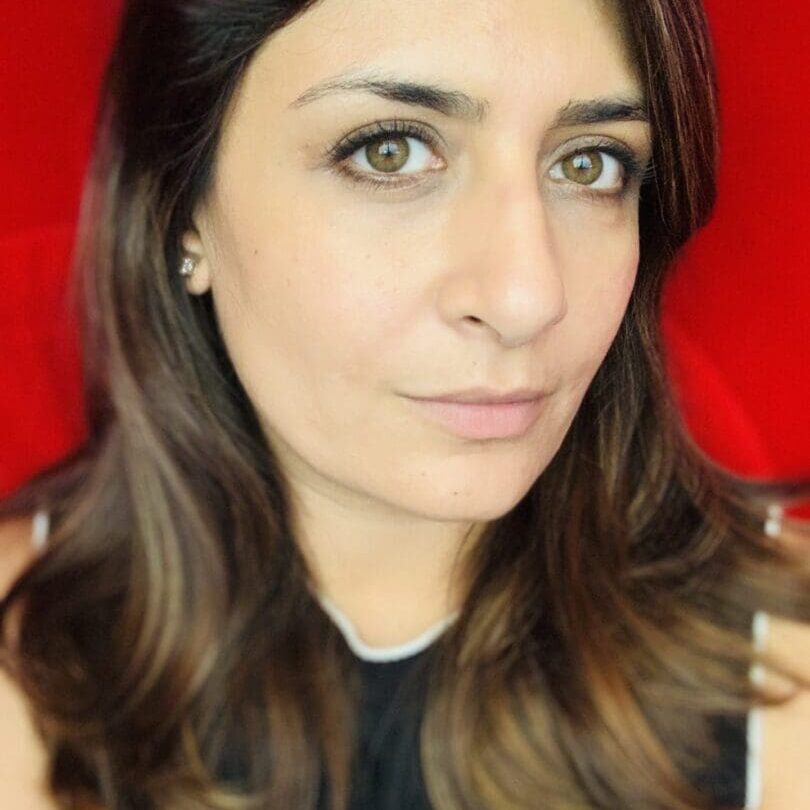 Woman with brown hair and eyes.