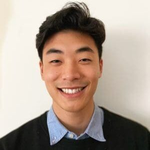 A young man smiling for the camera.