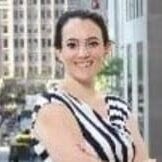 Woman smiling in stylish black dress